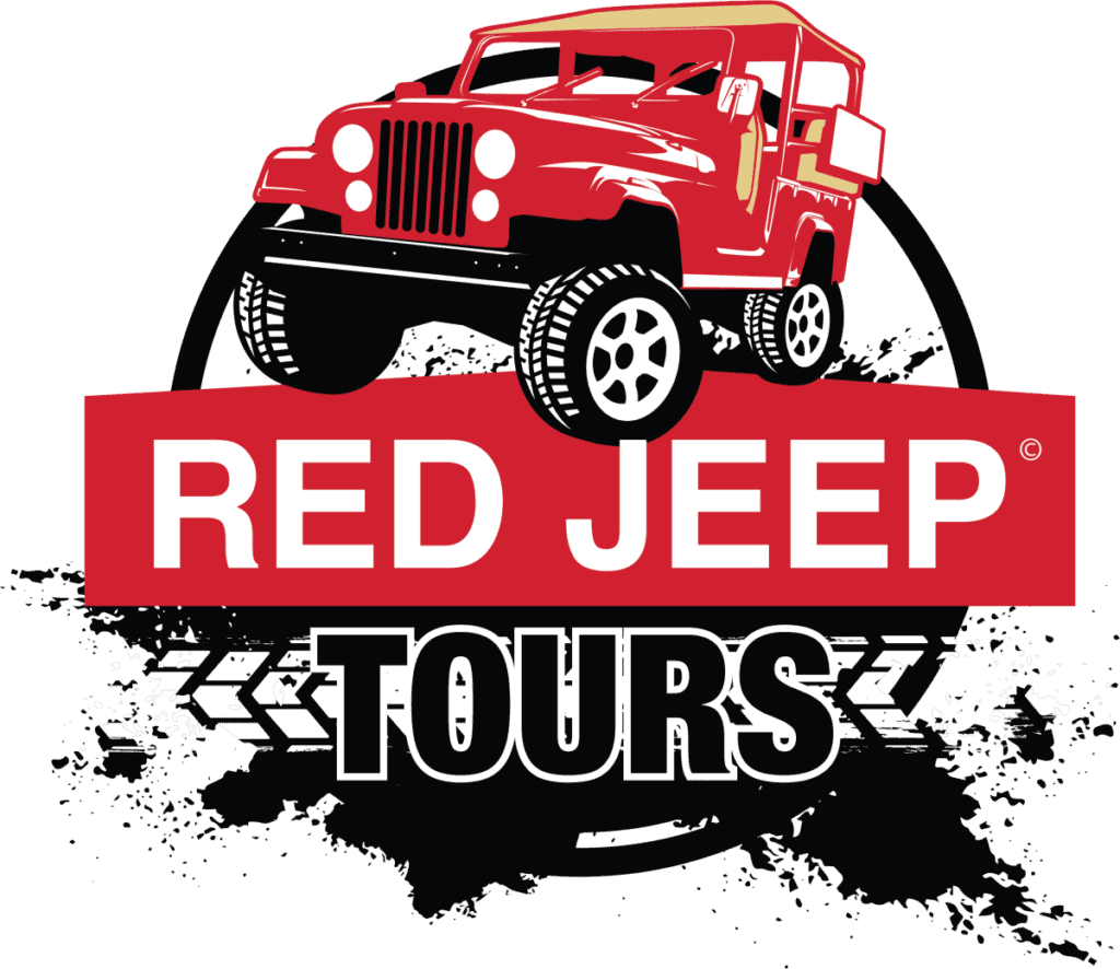Logo with a red jeep above the words "Red Jeep Tours" in bold white and black letters, with a white circular background and black tire track design.